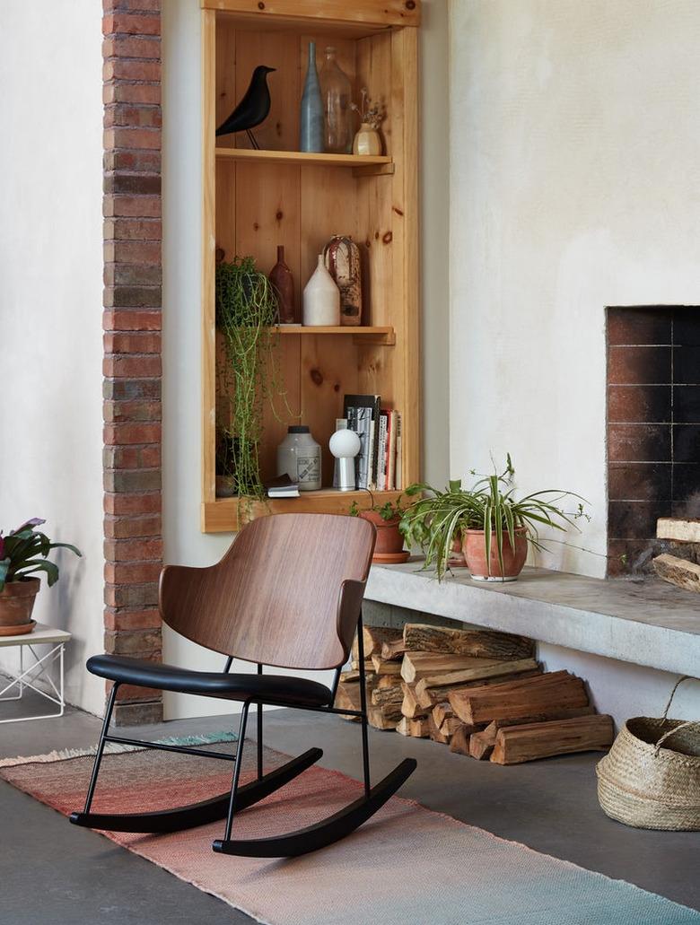 Design Within Reach contemporary rocking chair near fireplace