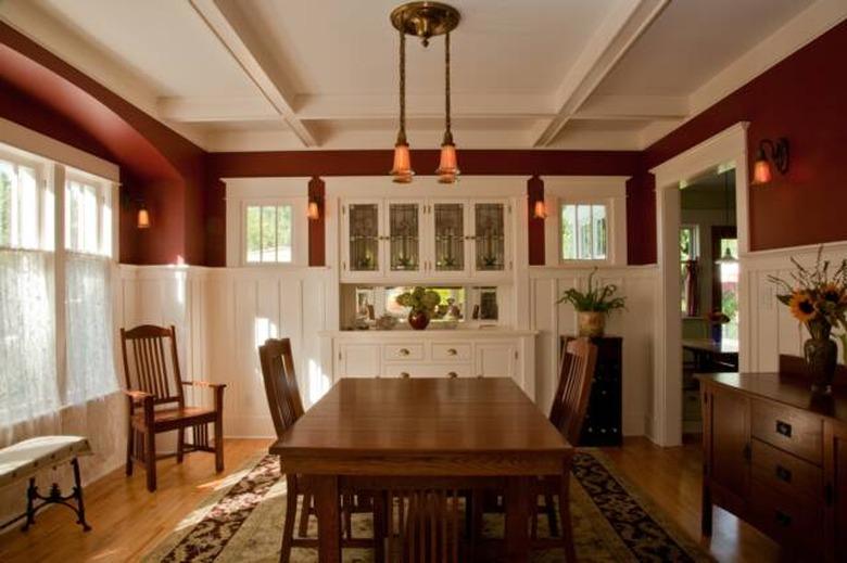 craftsman style dining room with white built-in cabinets and wood table and chairs