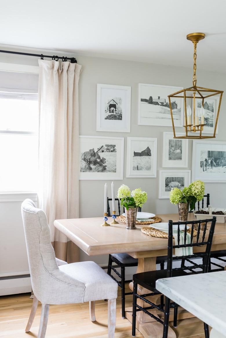 dining room with craftsman style lighting fixture, wood table, and mixed style chairs