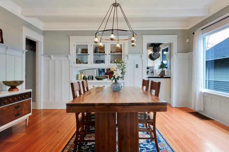 dining room with wood floors and table, with chandelier