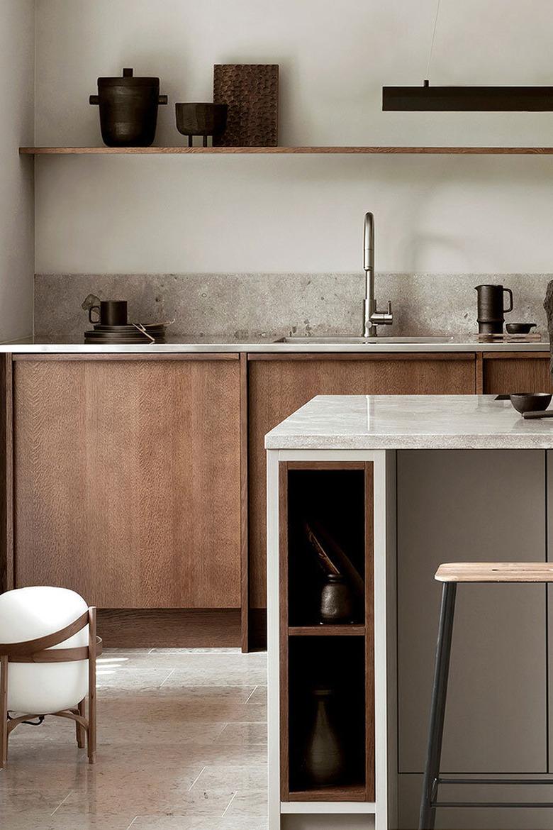 kitchen space with cream flooring, wood cabinets, and part of kitchen island