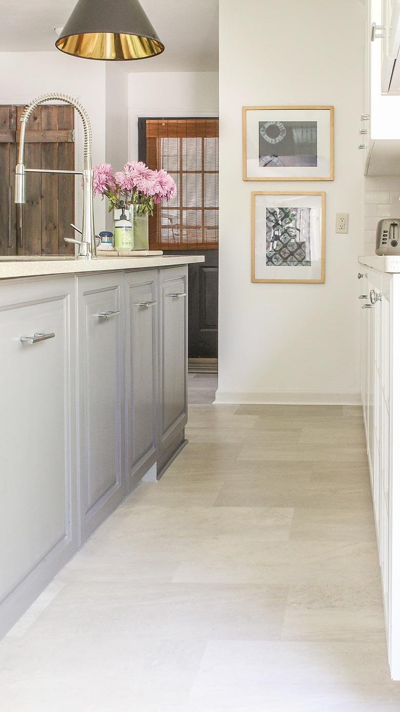 kitchen space with gray cabinets and vinyl cream flooring