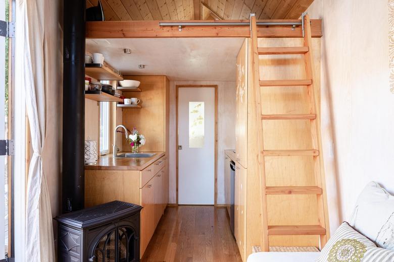 Tiny house in Ojai by Sol House with loft area and furnace.