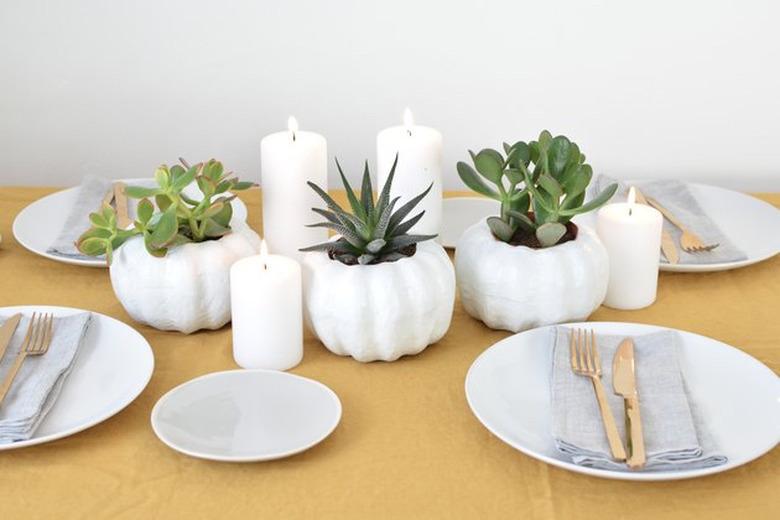 DIY fall decor idea pumpkin-shaped planter with succulents