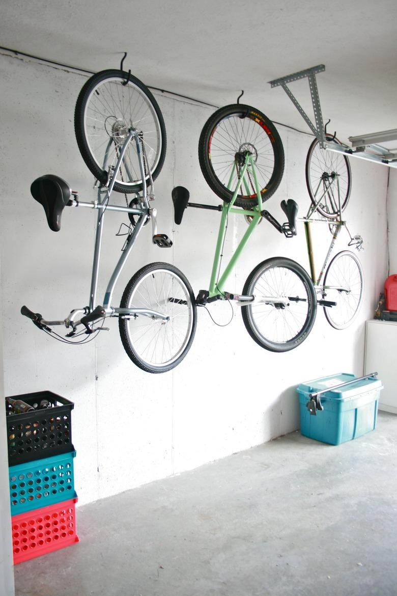 DIY garage organization idea with bikes hanging from garage ceiling