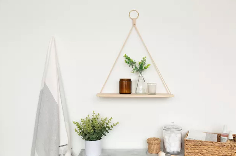 Hanging wood and rope shelf