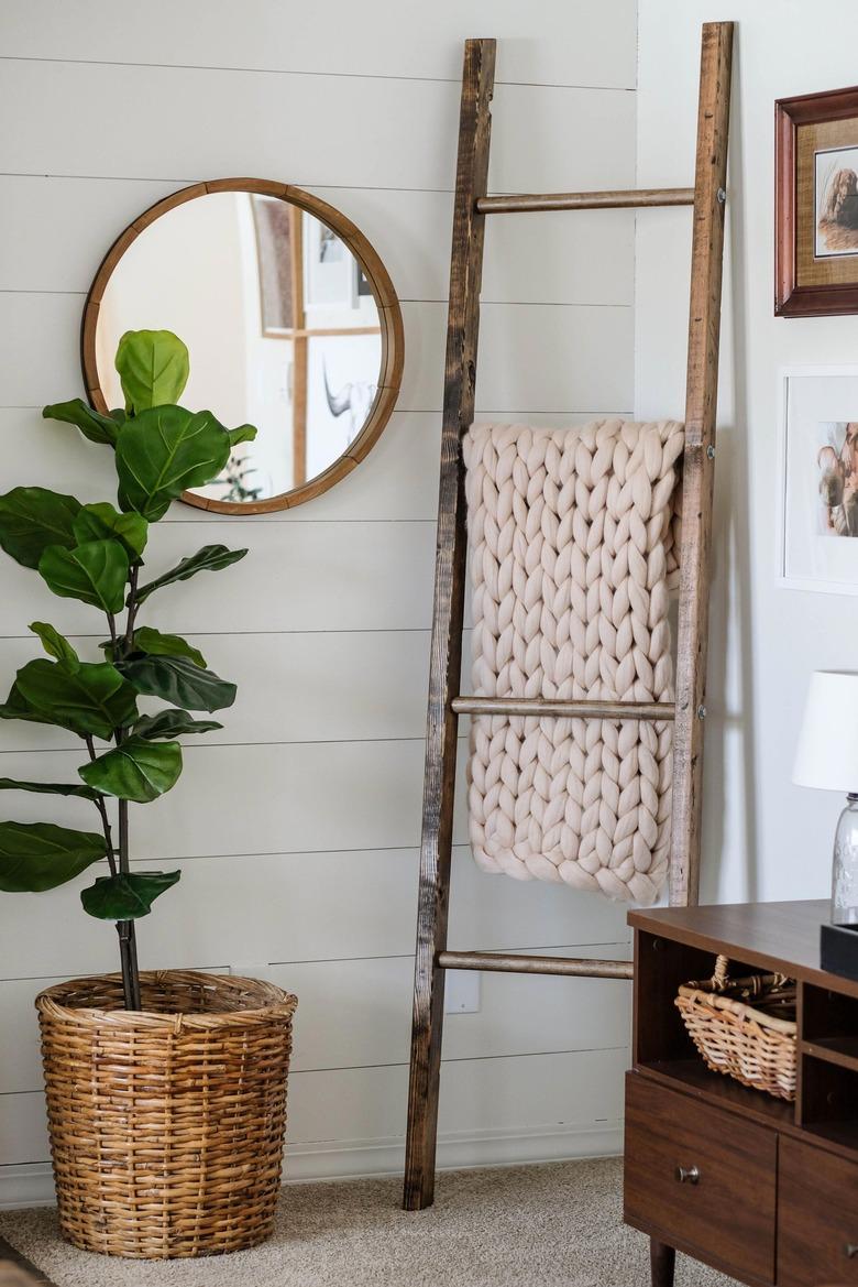 white nook with diy rustic decor wooden ladder and throw blankets