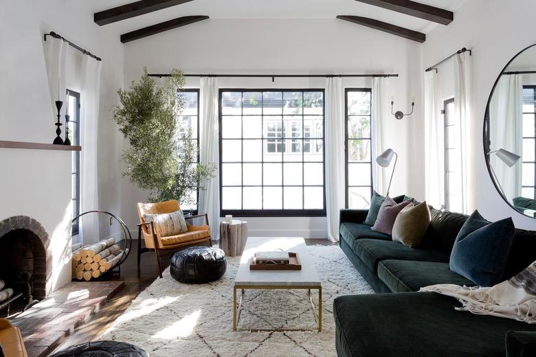 living room with dark green velvet sectional