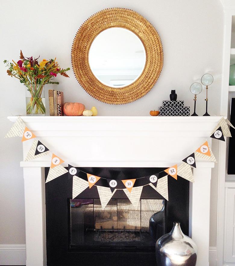 White mantle with black surround and farmhouse fall decor