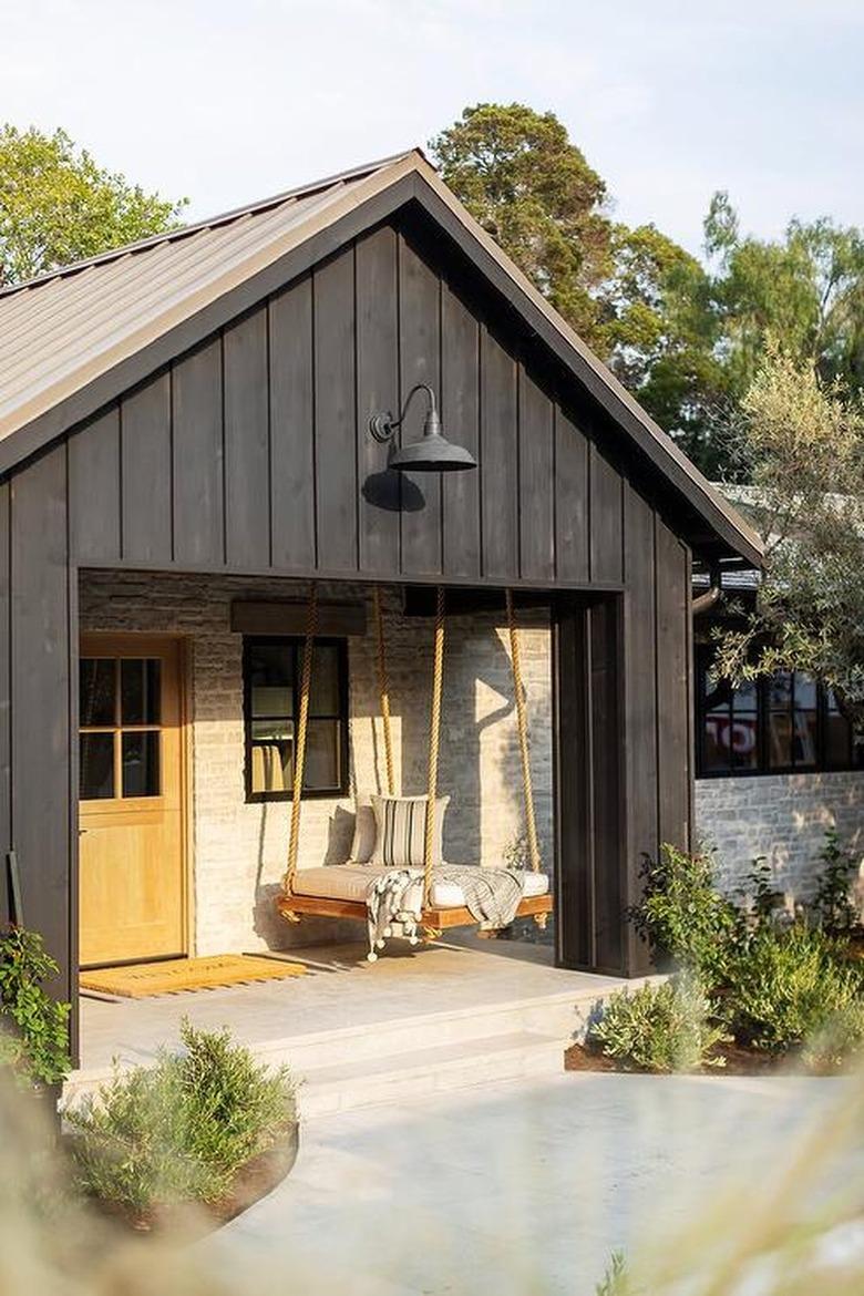 porch with hanging swing bed