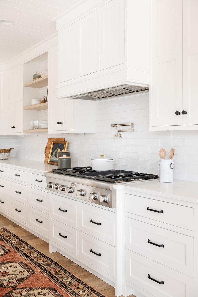 simple white kitchen with white stove and gas stovetop