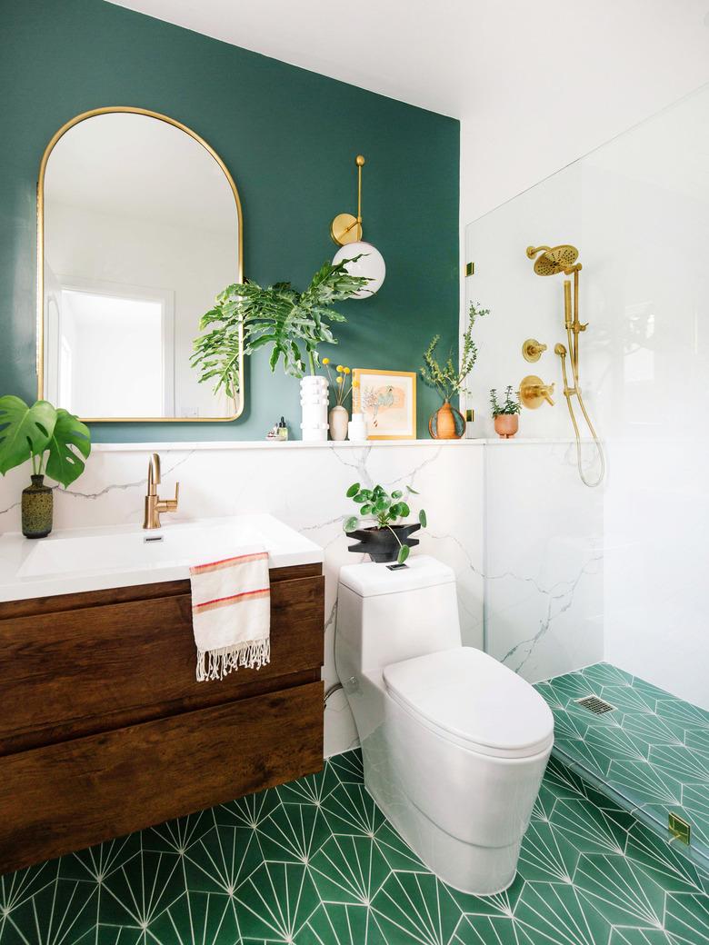 Green boho room with patterned tile floor and green accent wall