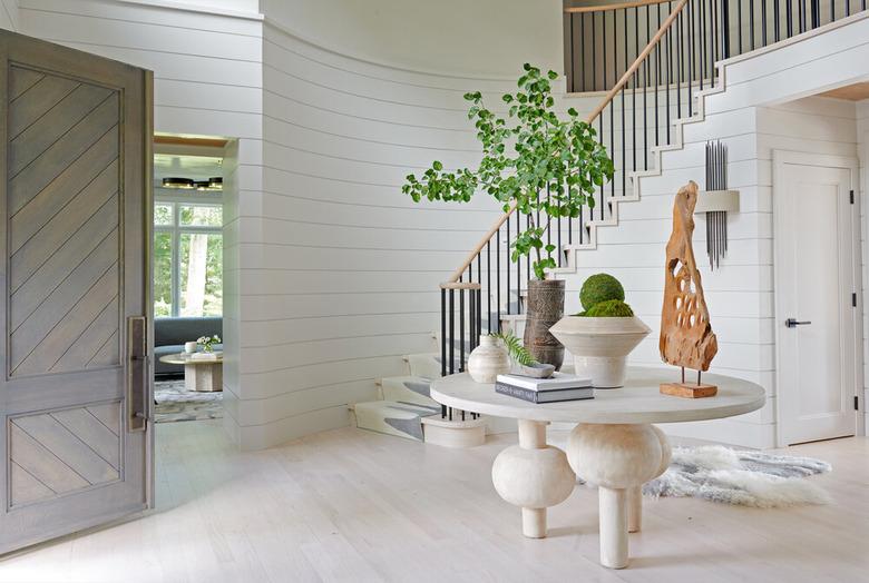 whitewashed hardwood floor colors in entryway with staircase and white shiplap