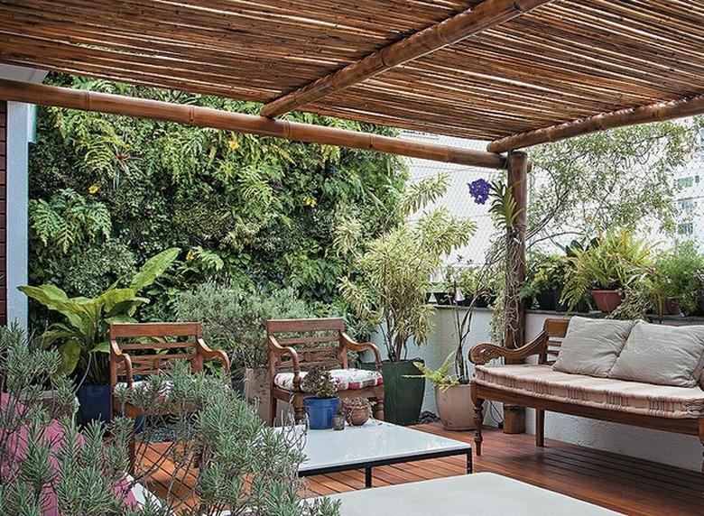 Deck with pergola, bench, chairs, plants