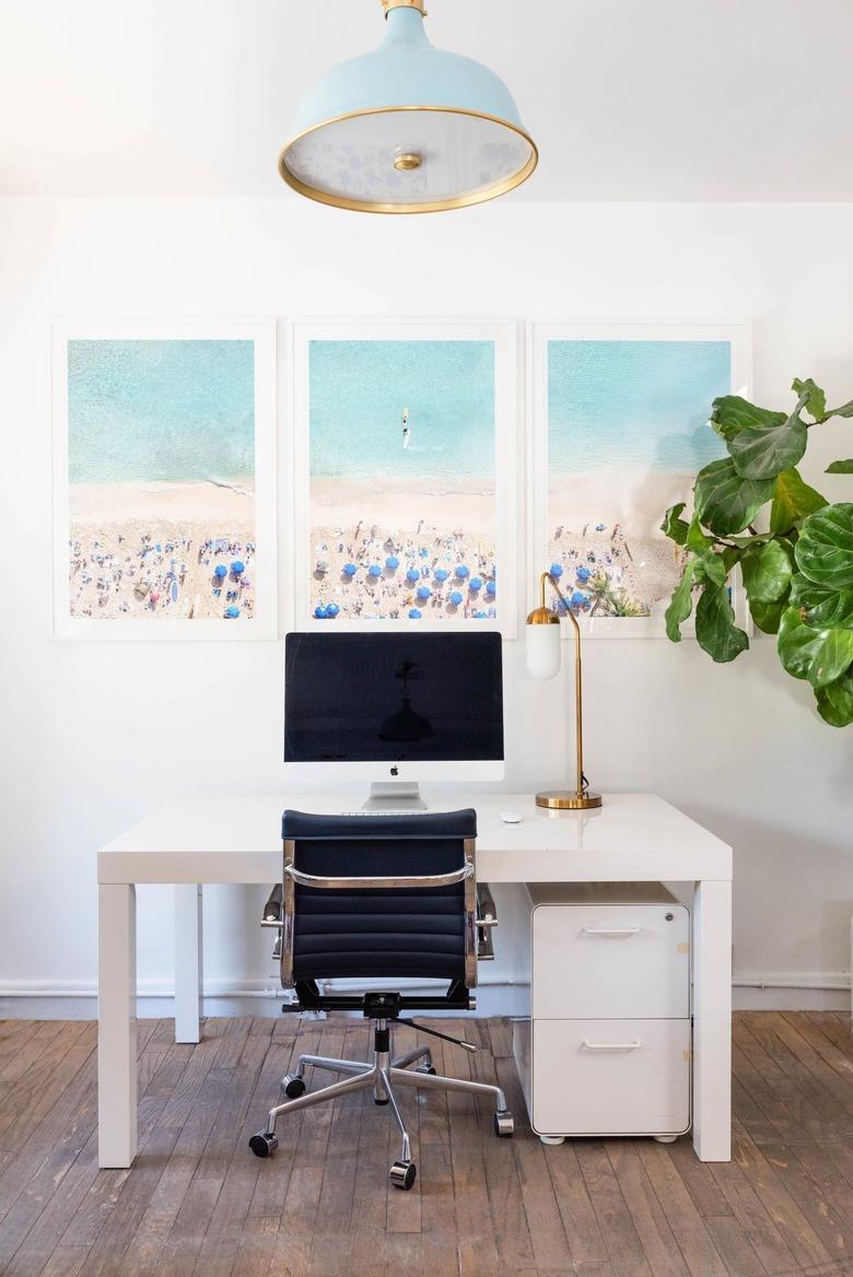 blue and brass pendant light in coastal home office