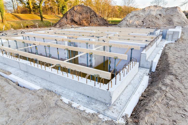 Construction site with foundation for new house.