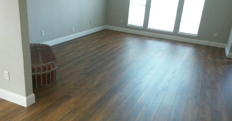 New laminate floor with baseboards.