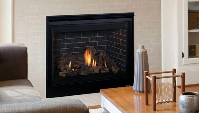 Gas or propane fireplace insert in living room.