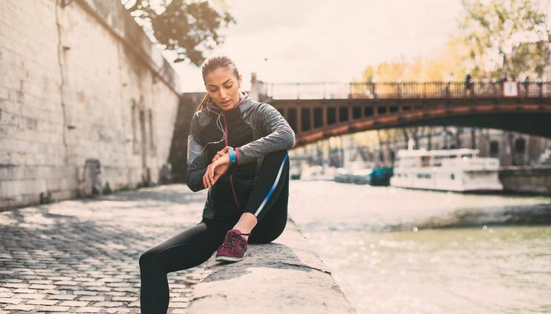 Runner checking her watch.