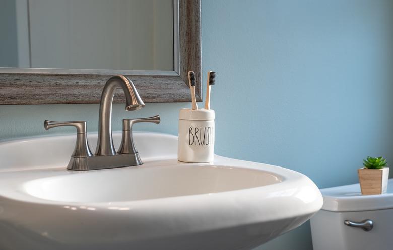 Earth friendly bamboo toothbrushes on the bathroom sink