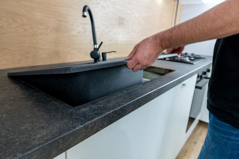 Installing a new ceramic sink in kitchen