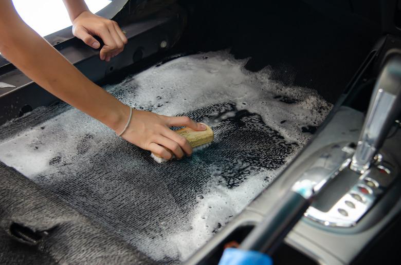 Washing the carpet in the car.