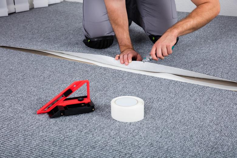 Carpenter Laying Carpet