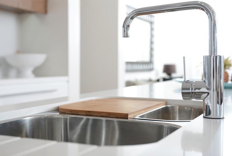 Stainless steel sink with mixer tap