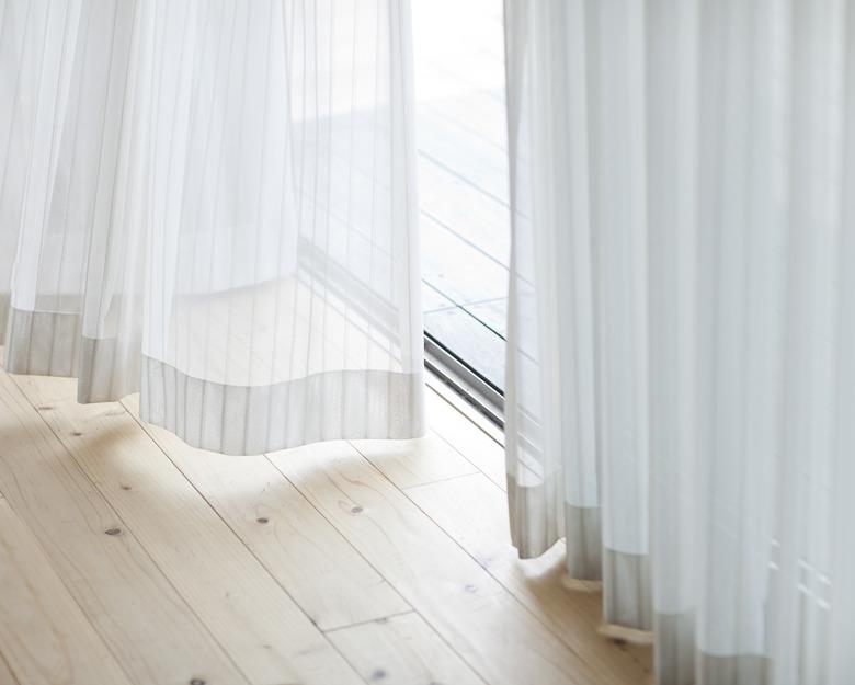 Floor-length white curtains