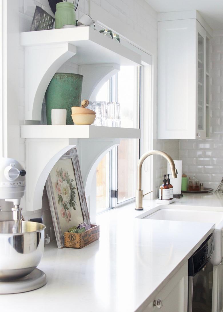 white open shelving with decor in industrial farmhouse kitchen