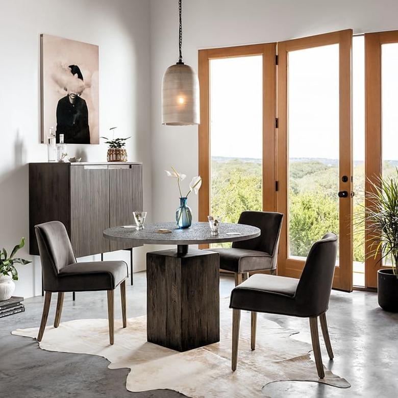 industrial furniture in dining room with round table and chairs