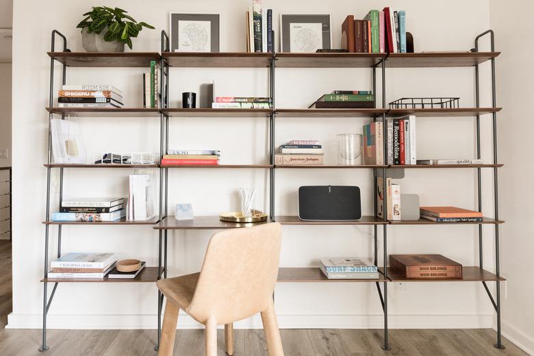 industrial pipe shelving wall unit with chair