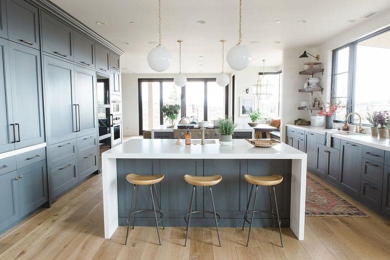 kitchen with gray cabinets and natural wood floors