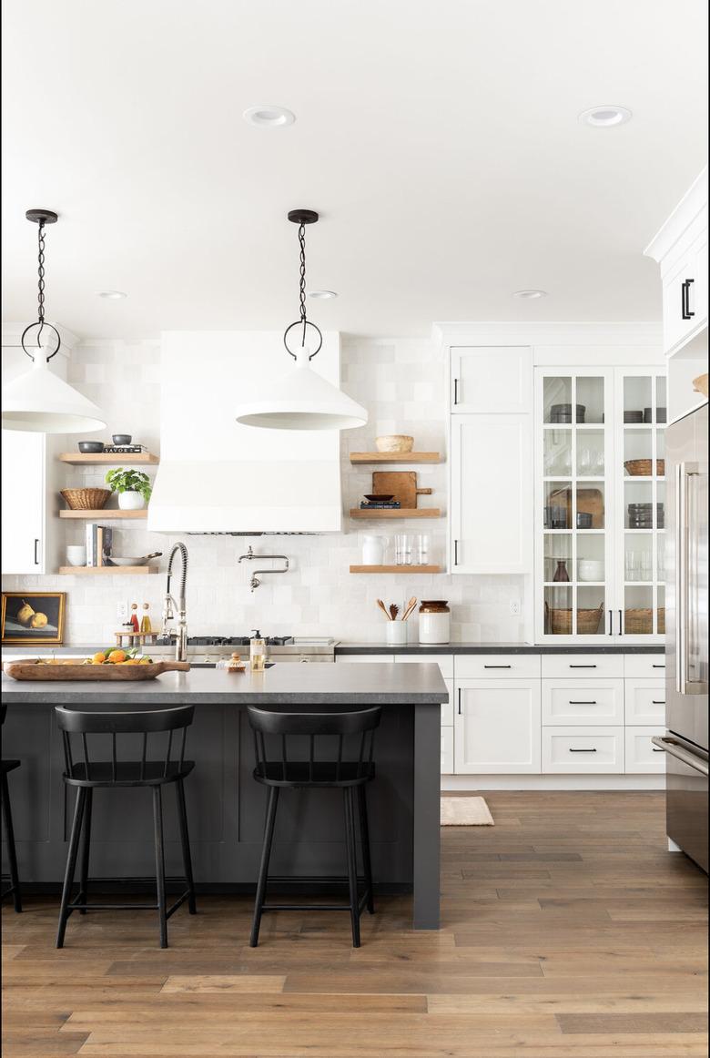 Black kitchen island table in white kitchen