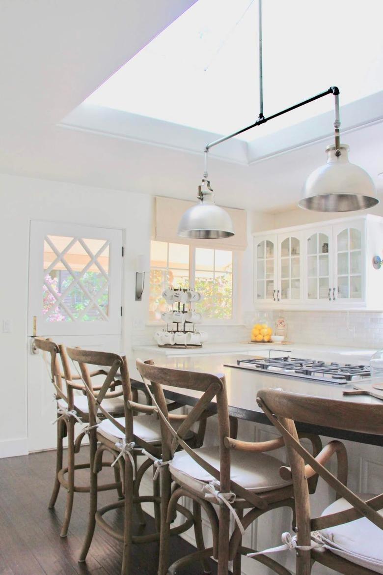 Kitchen island with stove and wood seating