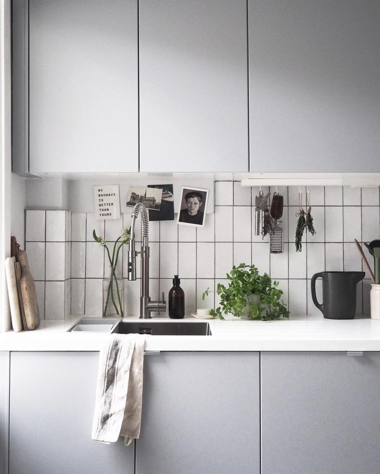 light gray cabinets in minimalist kitchen with single bowl sink