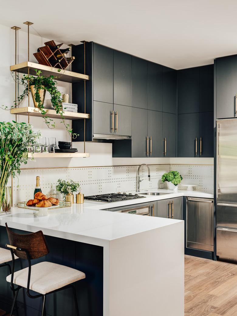 modern kitchen with mixed metal finishes and single-bowl sink