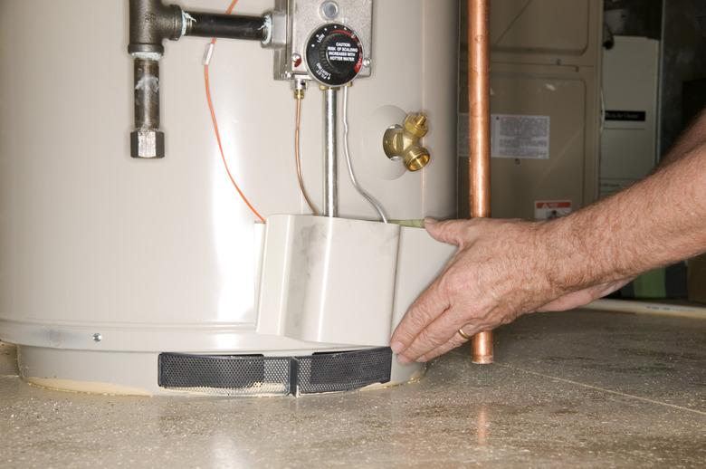 Man checking water heater