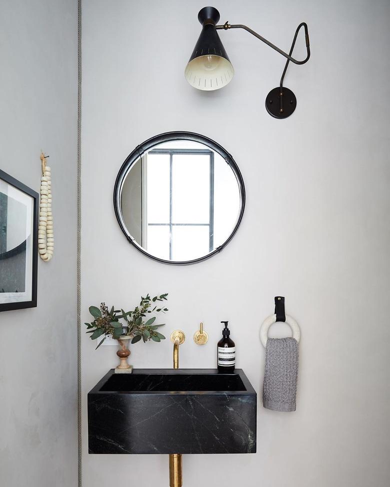 black and white modern bathroom with marble bathroom sink