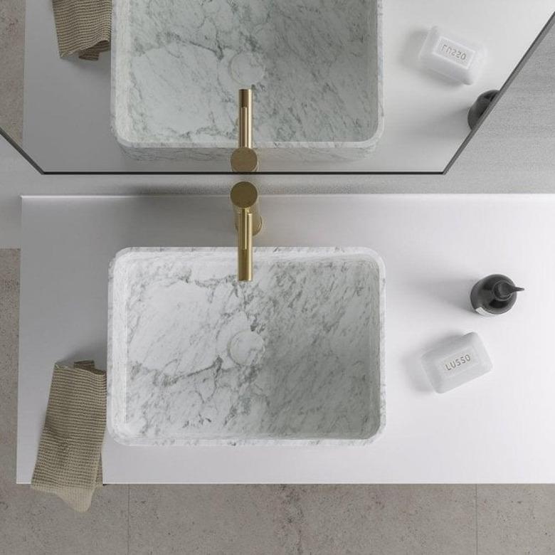 minimal bathroom with white marble bathroom sink