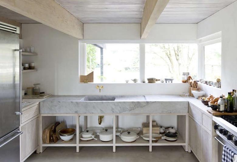 cabin kitchen with thick marble countertop and integrated sink