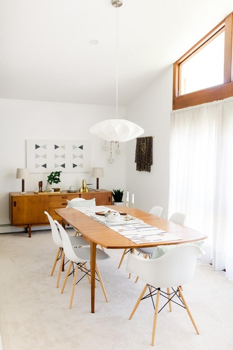 Neutral midcentury dining room idea with white accents