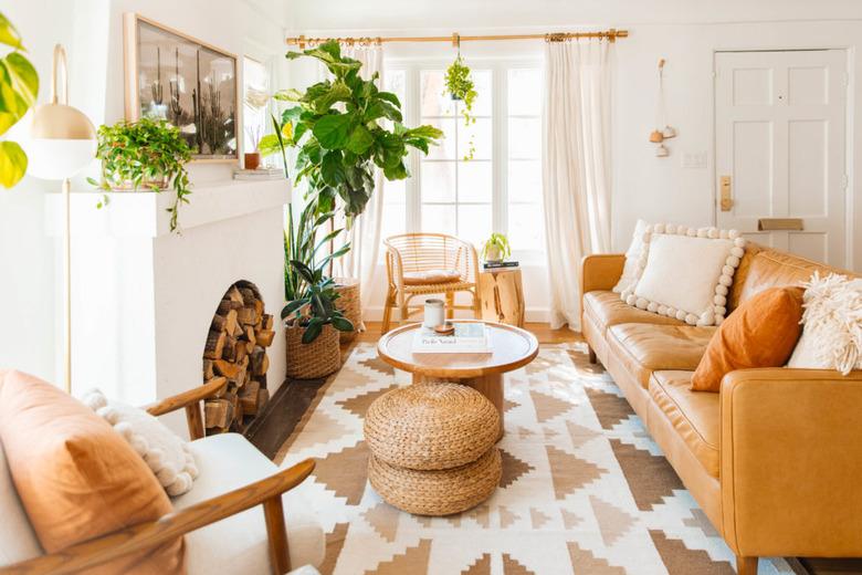 Midcentury modern bohemian living room in neutral colors and natural furniture