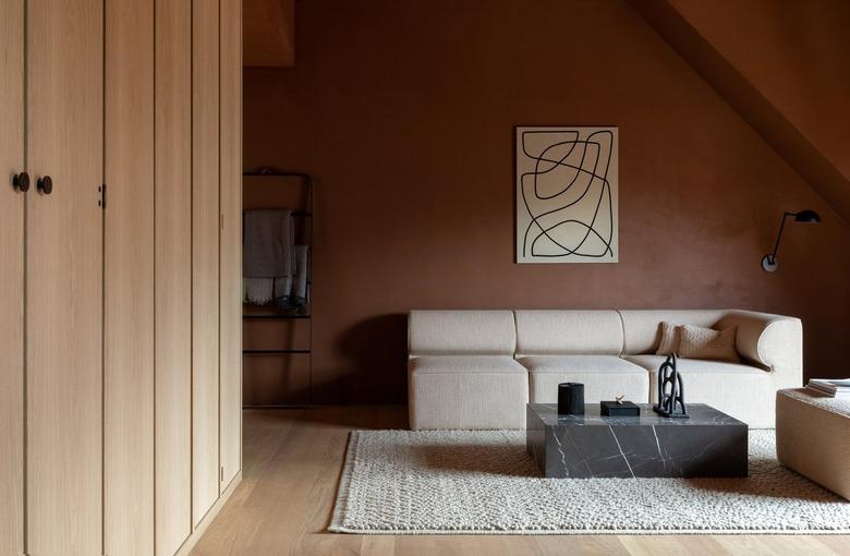 living room with terra cotta wall paint