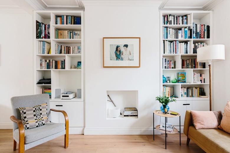 bookshelves in a living room with hardwood floors