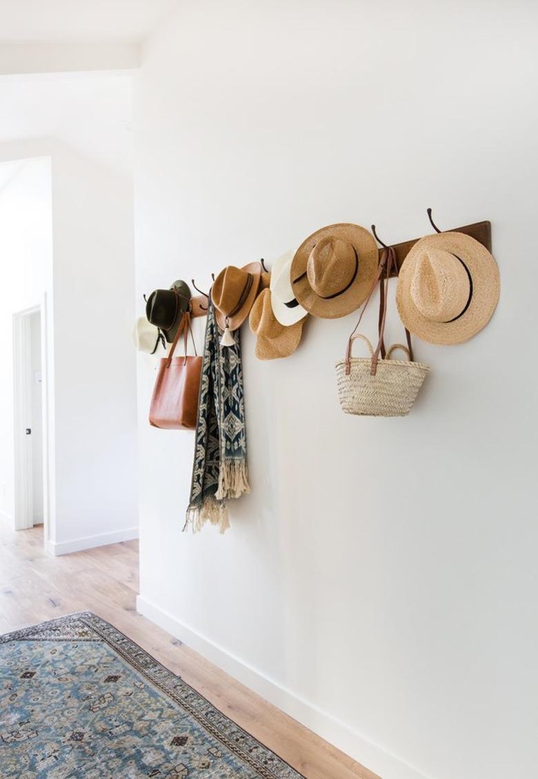 hallway with hanging hats