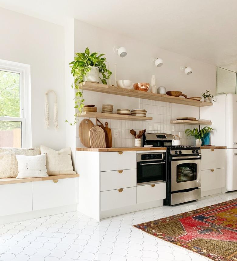 Scandinavian kitchen floor tile in white fish scale with white cabinets