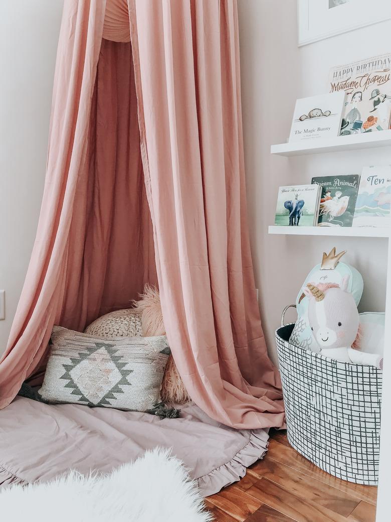 girls bedroom idea with pink ceiling canopy for reading nook