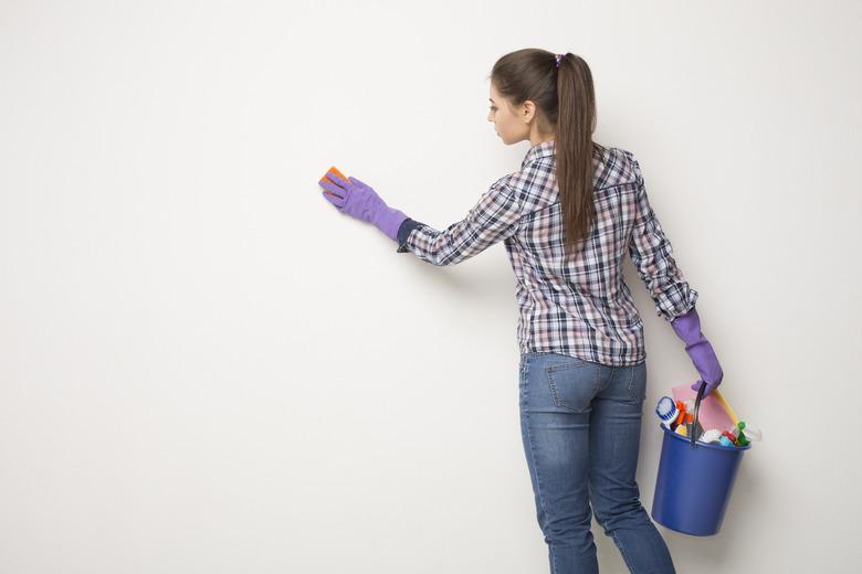 Cleaning a wall.