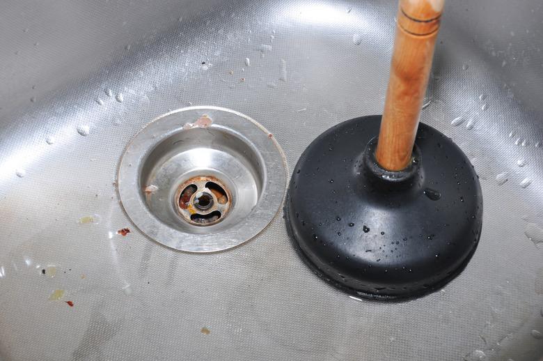 Plunger and kitchen sink.